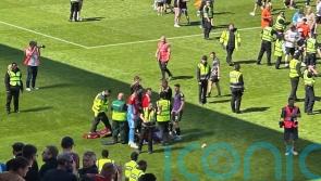 Man in court after footballer hit by part of chair at match