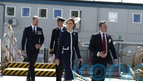 Kate names Royal Navy warship by smashing bottle of whisky against hull
