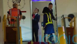 Macron cites horseplay as wife appears to push the French leader