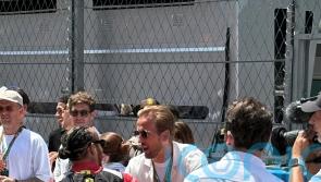 Harry Kane greets Lewis Hamilton as England players take in Spanish Grand Prix
