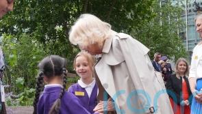 Queen ‘warms up’ six-year-old girl’s ‘cold hands’ during blustery outdoor event