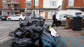Bin workers in Birmingham vote to continue strikes over pay and jobs