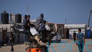 12 killed by Israeli fire near aid points, Palestinians say