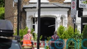 Charity worker found stabbed in house after gas explosion