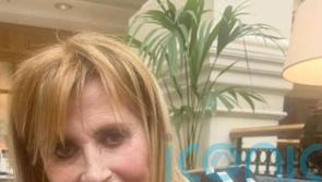 Woman arrested on suspicion of murder after 69-year-old found stabbed at home
