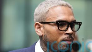 Chris Brown arrives at court to enter plea over ‘bottle attack’ charge