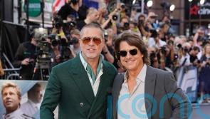 Brad Pitt embraces Tom Cruise at F1: The Movie premiere