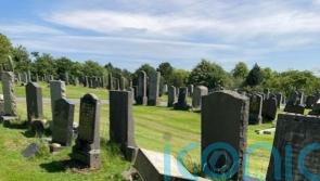 Crucifix set alight and headstones demolished in ‘senseless’ cemetery attack