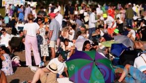 Wimbledon fans prepare for 34C heat with wine, umbrellas and strawberries