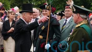 King and Queen begin Holyrood Week under guard of ceremonial female bodyguards
