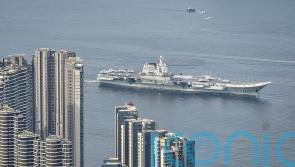 Chinese aircraft carrier sails into Hong Kong to boost patriotism