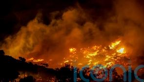 Firefighters race to contain wildfires in Greece as thousands evacuated