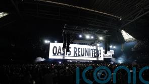 Oasis take to stage for first gig in 16 years to jumping crowd and flying cups
