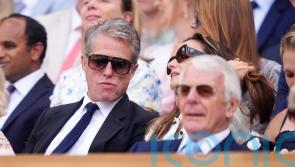 Hugh Grant and the Queen among famous faces in crowd during day 10 of Wimbledon