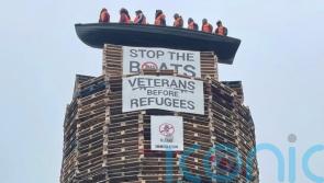 Calls for removal of migrant effigies in boat placed on loyalist bonfire in NI