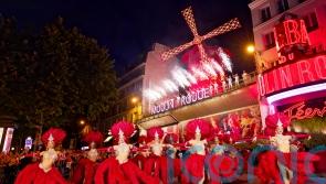Moulin Rouge’s windmill sails turn again after restoration