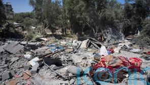 Six children among 10 people killed at water collection point by Israeli strike