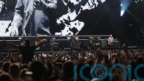 Fences erected at Oasis’s Manchester gig site as ticketless fans urged not to go