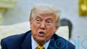 Just one in four US adults say Trump’s policies have helped them, poll finds