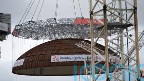 World’s largest crane ‘Big Carl’ lifts reactor dome into place at Hinkley Point C