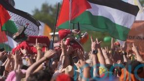 Kneecap and Brian Eno call on artists to join syndicate to support Palestine