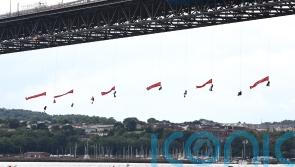 Forth Road Bridge closed as 10 Greenpeace activists abseil under it with flags