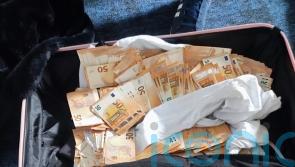 Three men arrested after gardai find almost 350,000 euro cash in suitcase