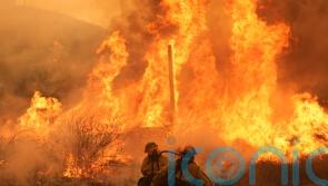 Fast-growing brush fire forces thousands to evacuate area north of Los Angeles