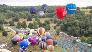 Dozens of hot air balloons take to the skies above Bristol