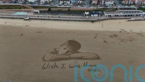 Huge sand artwork highlights how child poverty means millions miss out in summer