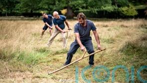 Scythers cut back the King’s wildflower meadow in annual tradition