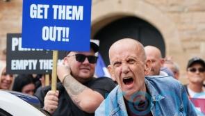 Opposing sides chant and shout outside asylum hotel in Perth