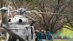 Suspect identified as Australia police shooting manhunt continues