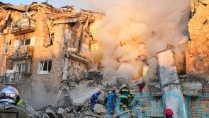 Peace efforts in limbo as Ukraine’s capital mourns 23 dead after Russian attack