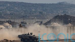 Strikes across Gaza kill at least 31 as scholars accuse Israel of genocide
