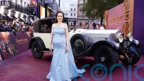 Michelle Dockery reveals she is pregnant with first child at Downton premiere
