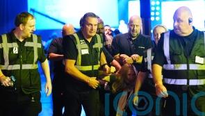 Climate protesters removed from Reform conference after heckling Nigel Farage