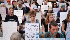 Protesters defy police warnings with signs supporting Palestine Action
