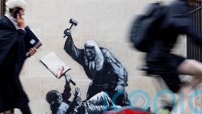 Concealed Banksy artwork shows judge beating unarmed protester