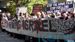 Three arrested after protest outside defence event