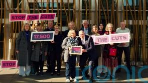 Campaigners deliver 17,500-name petition to stop cuts to dementia care