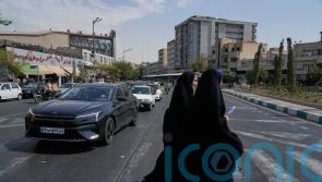 Iran denounces reimposed UN sanctions and considers response