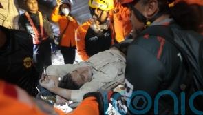 At least 65 students presumed buried under rubble of collapsed Indonesian school