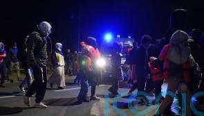 Riot police stop migrants from reaching beach in French town