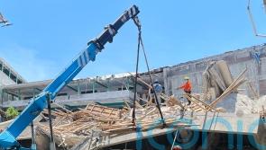 Rescuers use heavy machinery as hopes fade of finding school collapse survivors