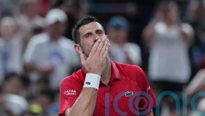 Novak Djokovic collapses in Shanghai heat but battles back to reach last eight