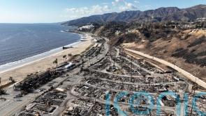 Authorities charge man over deadly wildfire that levelled LA neighbourhoods