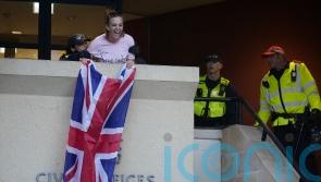 Charges dropped against woman who unfurled flag from Epping council building