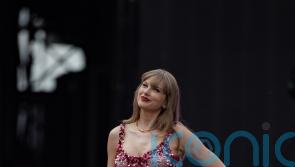 Taylor Swift retains number one album and single in UK charts for second week