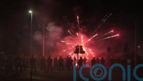 Fireworks and stones thrown at police for second night at asylum seeker hotel